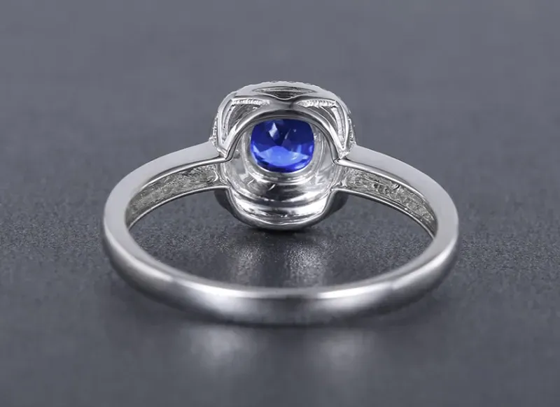【18k金镶蓝宝石戒指 宝石参数:0.55ct 配石:钻石63颗,总重2.20克,圈口:14号(可改圈)】图2