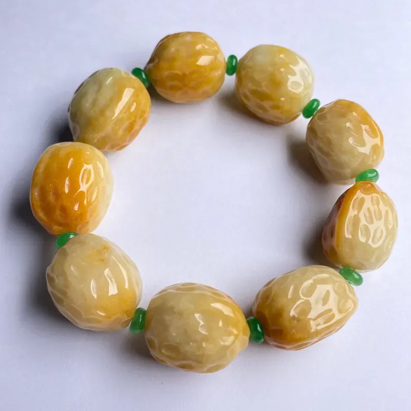 豆种黄翡核桃手串 9颗 色彩艳丽 款式时尚 中间隔珠为装饰品 裸石尺寸24.8-21.5-18.6毫米