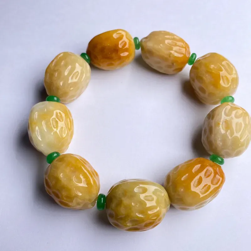 豆种黄翡核桃手串 9颗 色彩艳丽 款式时尚 中间隔珠为装饰品 裸石尺寸24.8-21.5-18.6毫米