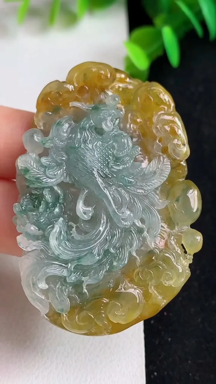 天然A货翡翠双彩凤凰吊坠，尺寸55.6-36.8-9.6，重量:34.18g
5月21日