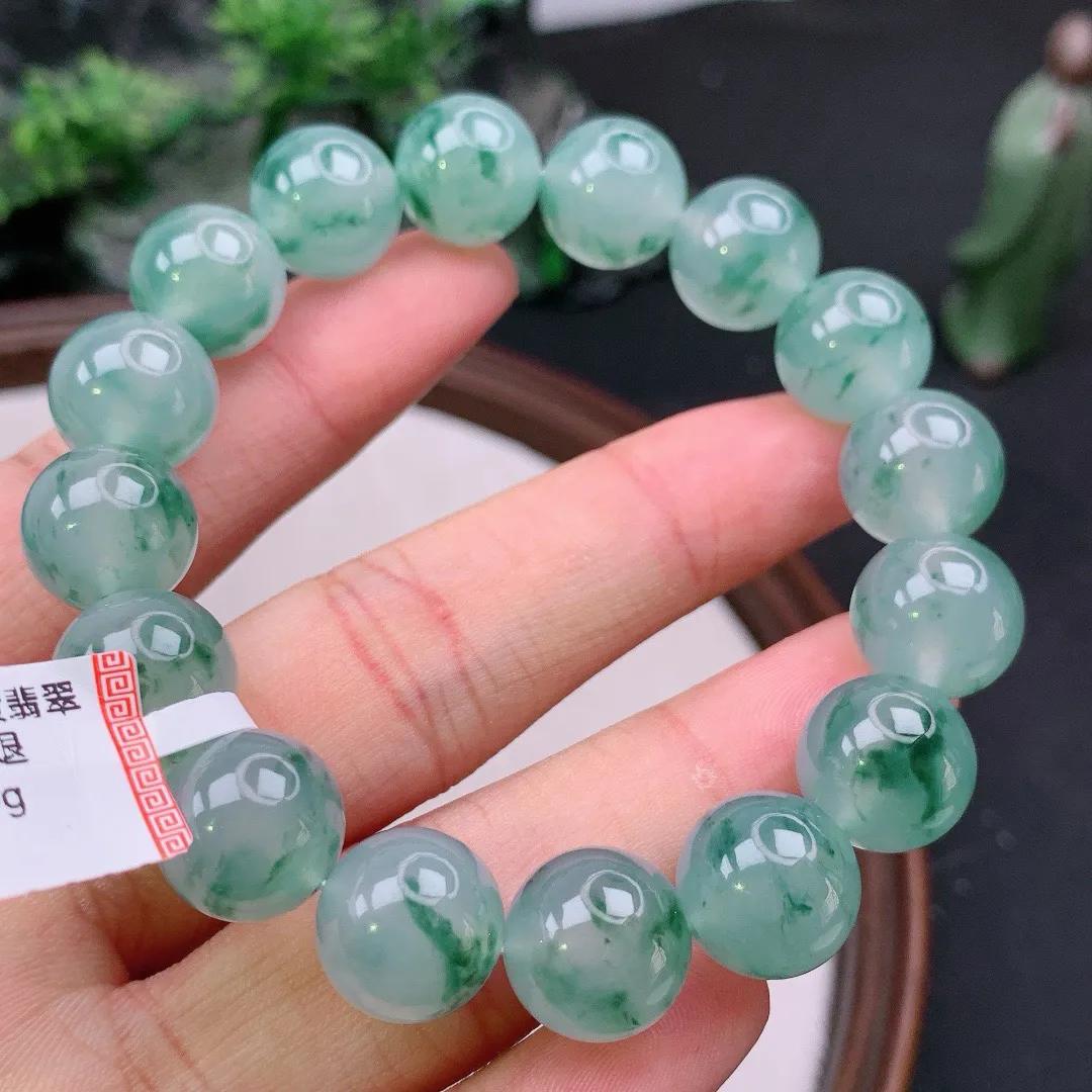 天然A货翡翠冰飘花起胶圆珠手串
尺寸13mm  重59.15g