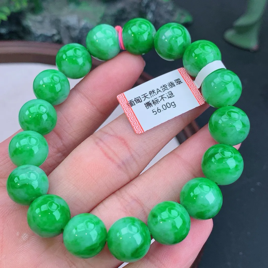 缅甸天然A货翡翠飘阳绿圆珠手串
尺寸12.4mm   重56.00g
