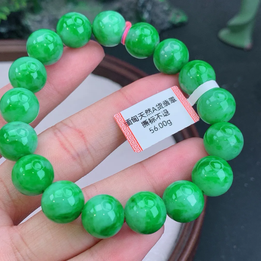 缅甸天然A货翡翠飘阳绿圆珠手串
尺寸12.4mm   重56.00g