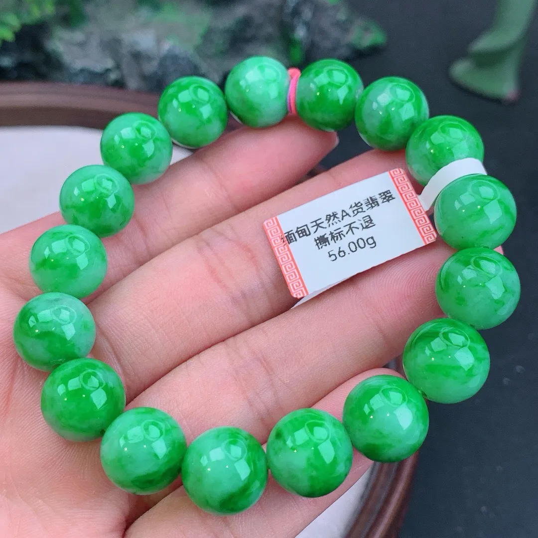 缅甸天然A货翡翠飘阳绿圆珠手串
尺寸12.4mm   重56.00g