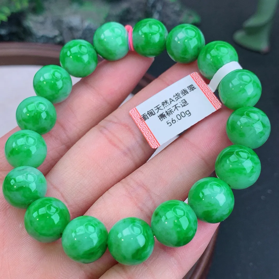 缅甸天然A货翡翠飘阳绿圆珠手串
尺寸12.4mm   重56.00g