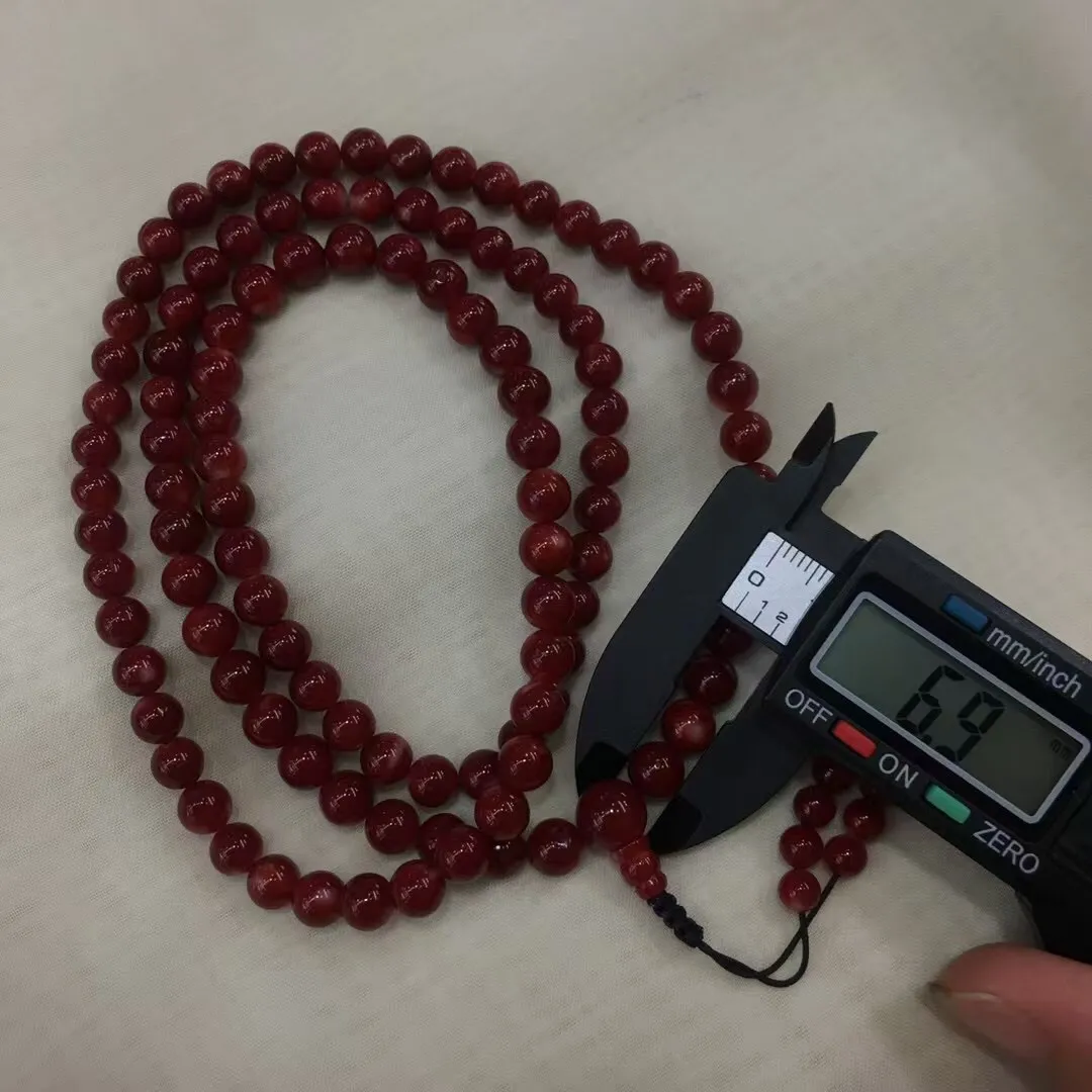 【天然日本阿卡牛血红珊瑚7mm圆珠108粒佛珠链】项链手链两用款！️遇不可求！日本产地，阿卡材料，牛血红颜色，光泽柔润透亮，直径约6.9-6.2mm，重量44.64克，珊瑚本为佛教珍宝，来自深海千年生长，有生长纹，属于有机宝石，气场强大，稀少珍贵！每粒均为天然无添加无修补！少虫眼少白芯！收藏精品！传承宝贝！