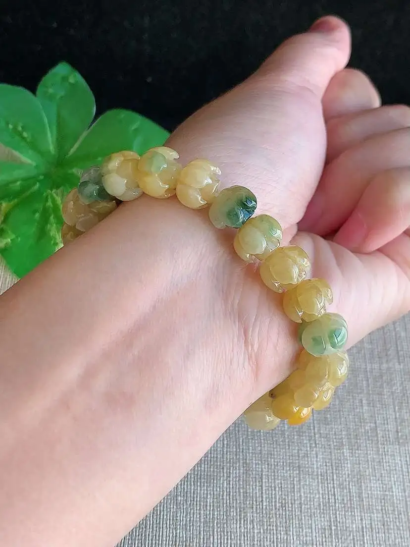 a货翡翠老坑冰种黄翡飘花莲蓬手串22颗，尺寸9.8×7mm 重量28.54g 1121