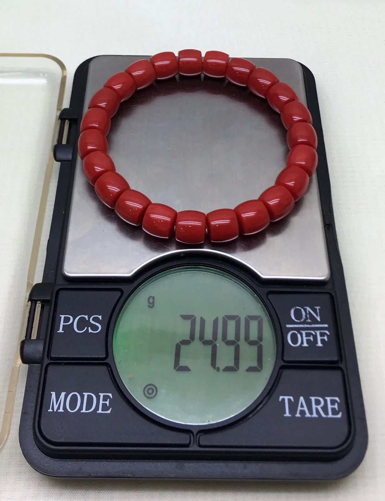 【天然深橘红珊瑚小9mm直切珠弹力手串】收藏佩戴两不误！天然无添加无优化，深橘红颜色，色泽好！品质好！颗颗天然！西班牙产地，科西卡材料，裸石尺寸约为8.82-8.75mm左右，重量24.99克。有个别天然小虫眼，可忽略不计。珊瑚自古被佛教视为珍宝，深海里千年生长的有生命宝石，有灵性，气场强大，佩戴者更有佛性，更有佛缘！