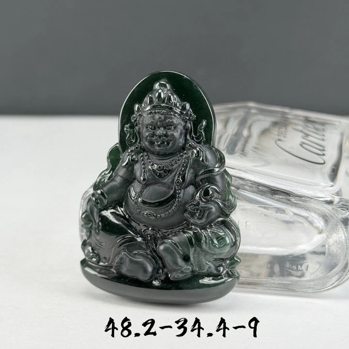 精品墨翠黄财神 种好色正 黑度极好 打灯通透 油性十足 尺寸48.2