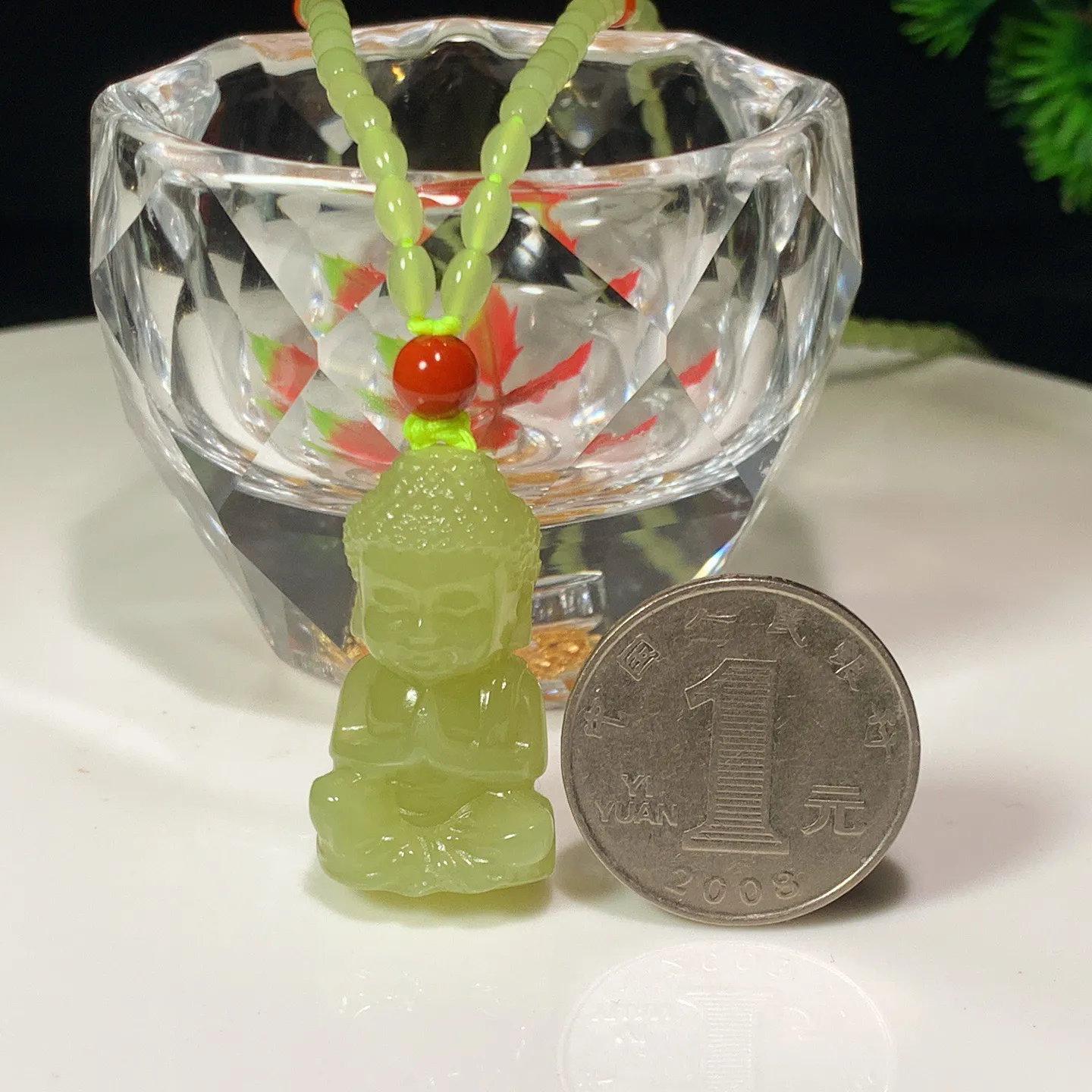 新疆和田玉若羌黄口料宝宝佛挂件。尺寸31/18/14重21.7克。玉质细腻油润。手推出油。佩戴高端典雅。lt251127