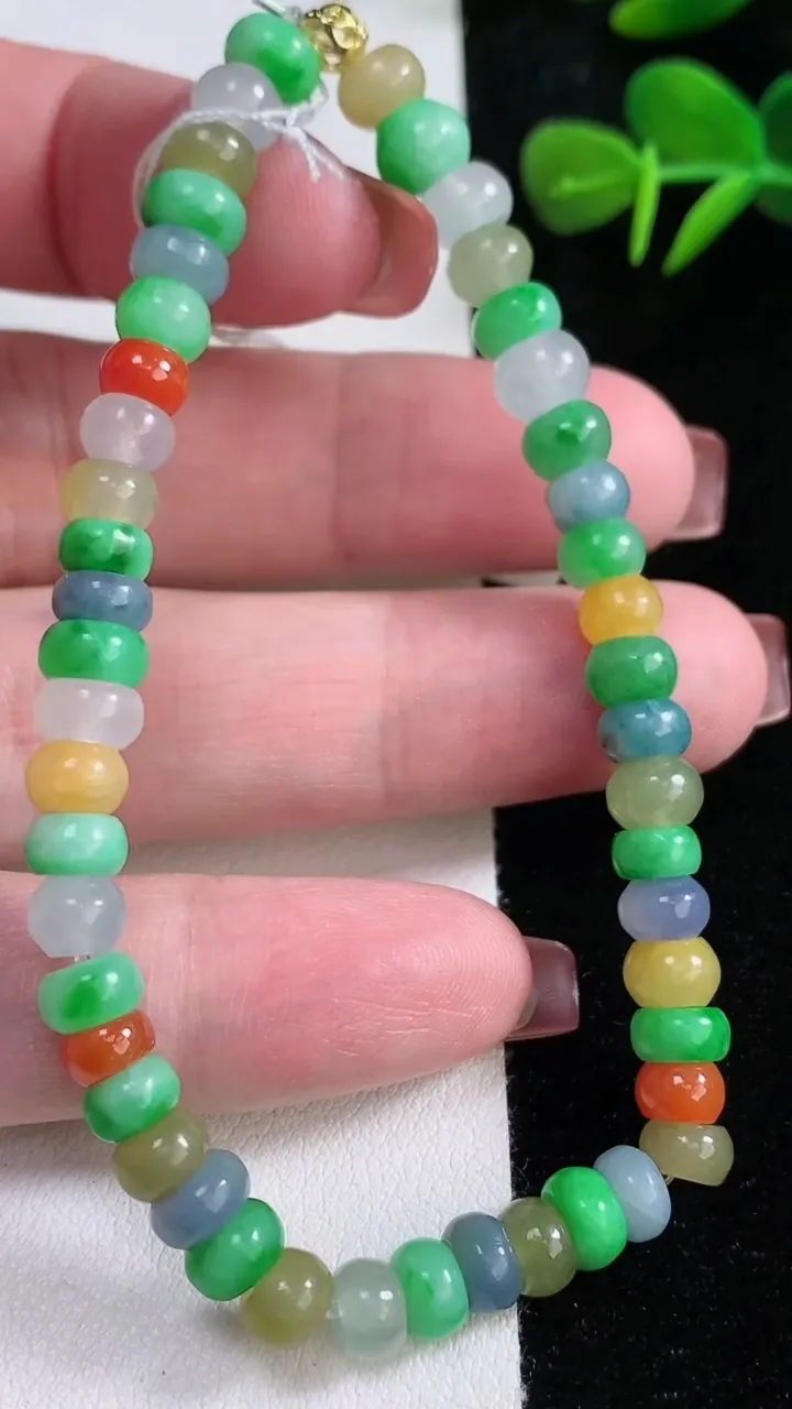天然A货翡翠四彩算盘珠手串，尺寸6.5-4-48颗，重量:15.38g12月16日
工厂直销收藏佳品,种好水足，色泽均匀，有种有色，上手高大气！