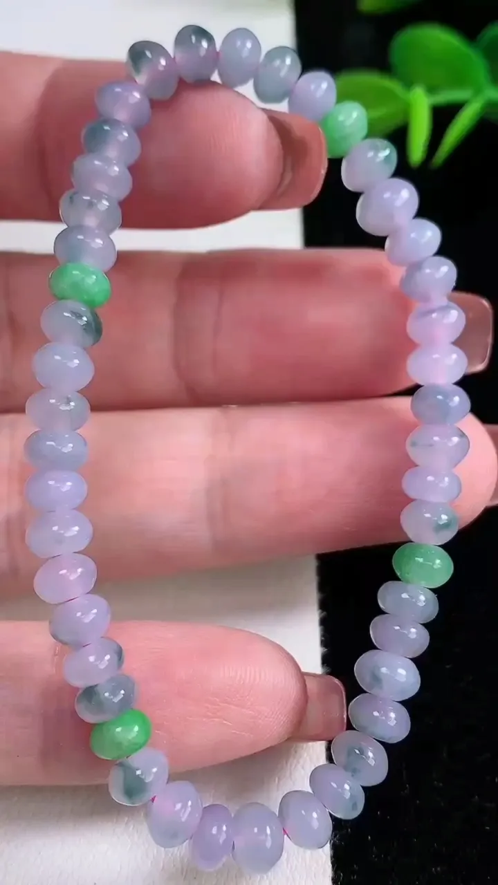 天然A货翡翠双彩紫罗兰算盘珠手串，尺寸5.6-3.3-45颗，重量:10.06g12月16日
工厂直