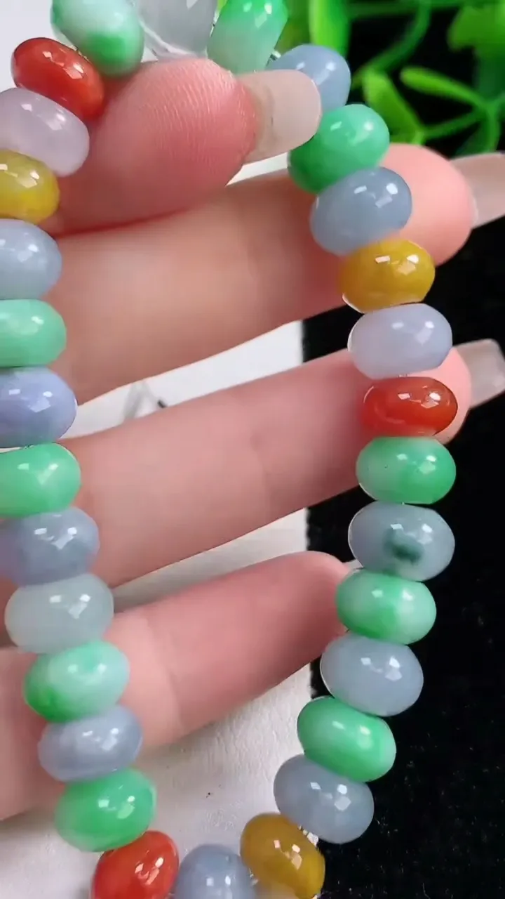天然A货翡翠四彩算盘珠手串，尺寸9.7-6.2-30颗，重量:34.39g12月27日
工厂直销收藏佳品,种好水足，色泽均匀，有种有色，上手高大气！
