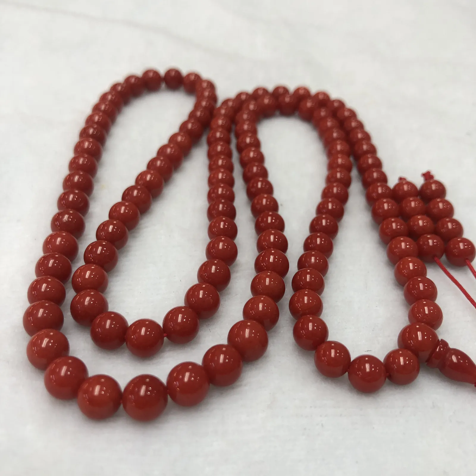 【天然深红珊瑚7mm圆珠108大佛珠串】项链手链两用款！传承精品！意大利产地，沙丁材料，深红颜色，珠子直径7-6.3mm左右！108粒加佛头弟子珠共120粒，可作念佛珠串，每料珠子均为天然珊瑚，珊瑚自古就为佛教珍宝，大师，高僧的喜爱之物！可加持，可守护！深海千年有机宝石，重量为48.55克！