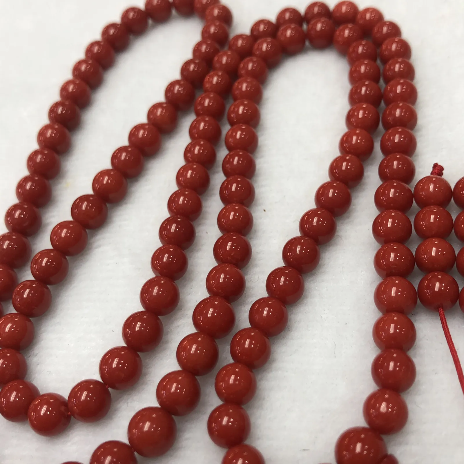 【天然深红珊瑚7mm圆珠108大佛珠串】项链手链两用款！传承精品！意大利产地，沙丁材料，深红颜色，珠子直径7-6.3mm左右！108粒加佛头弟子珠共120粒，可作念佛珠串，每料珠子均为天然珊瑚，珊瑚自古就为佛教珍宝，大师，高僧的喜爱之物！可加持，可守护！深海千年有机宝石，重量为48.55克！