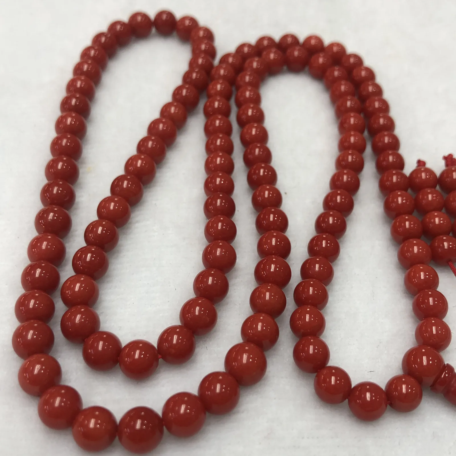 【天然深红珊瑚7mm圆珠108大佛珠串】项链手链两用款！传承精品！意大利产地，沙丁材料，深红颜色，珠子直径7-6.3mm左右！108粒加佛头弟子珠共120粒，可作念佛珠串，每料珠子均为天然珊瑚，珊瑚自古就为佛教珍宝，大师，高僧的喜爱之物！可加持，可守护！深海千年有机宝石，重量为48.55克！