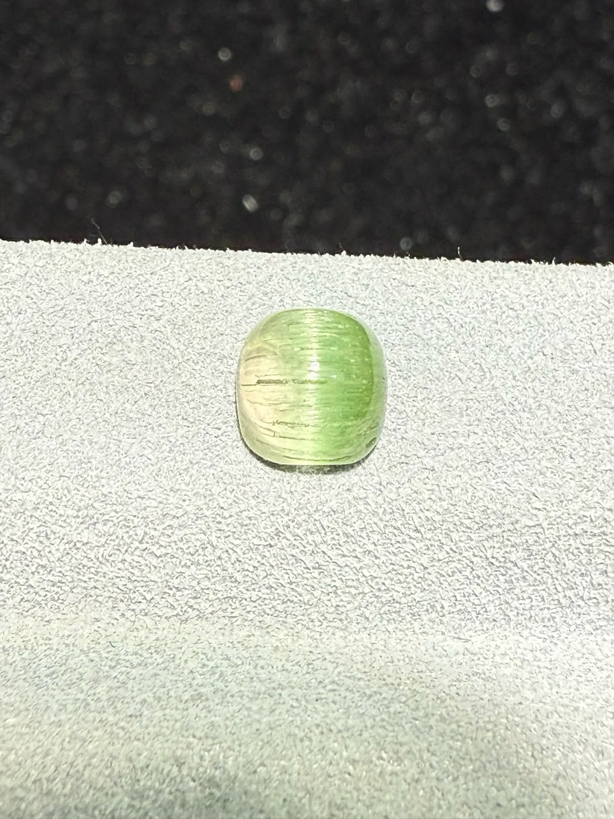 1.795克拉 西瓜碧玺猫眼裸石 猫眼效应犀利 晶体好[强][强] 水头十足 俏色系列可遇不可求 大约规格：6.4*6.3*4.7mm