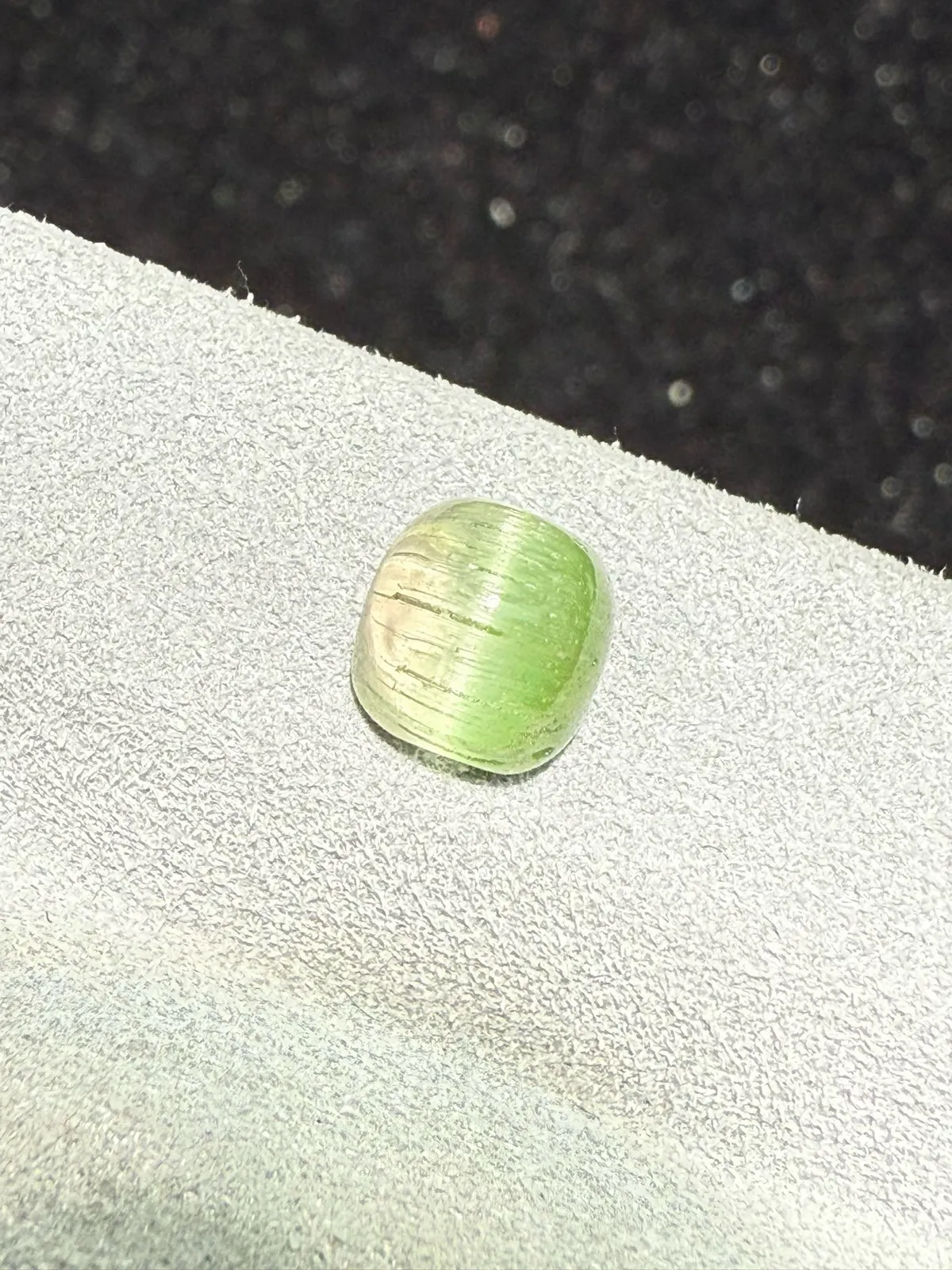 1.795克拉 西瓜碧玺猫眼裸石 猫眼效应犀利 晶体好[强][强] 水头十足 俏色系列可遇不可求 大约规格：6.4*6.3*4.7mm