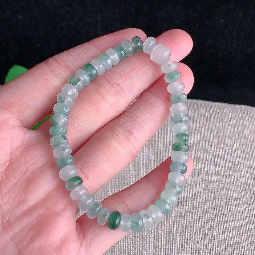 a货翡翠冰种飘花算盘珠手串45颗  尺寸6×3mm 重量14.13g 0101