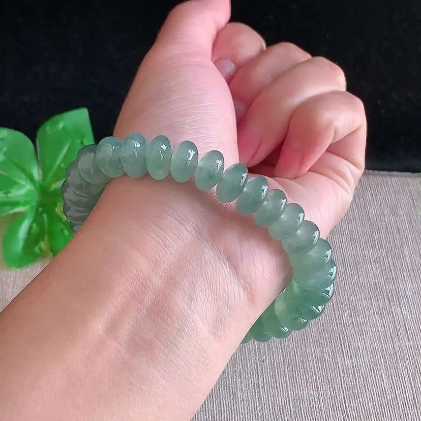 a货翡翠冰种晴水算盘珠手串32颗 尺寸10.7×5.4mm 重量46.00g 0104