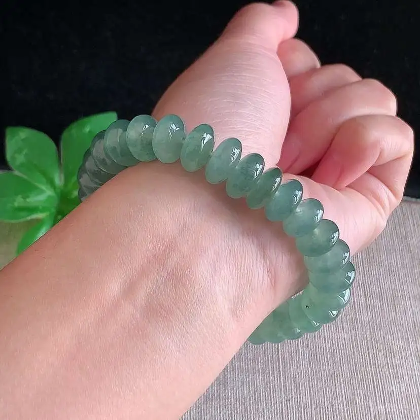 a货翡翠冰种晴水算盘珠手串32颗 尺寸10.7×5.4mm 重量46.00g 0104