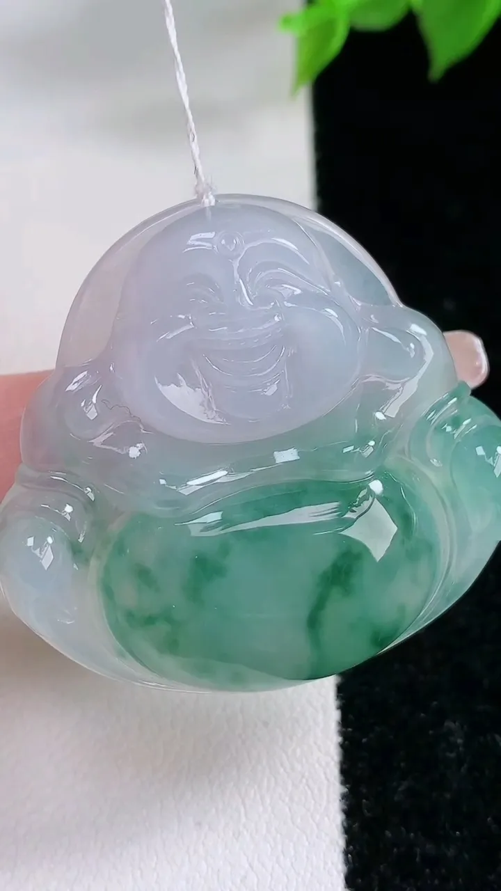 天然A货翡翠种飘花佛公吊坠，尺寸35.3-38.4-7.3，重量:12.69g
2月3日