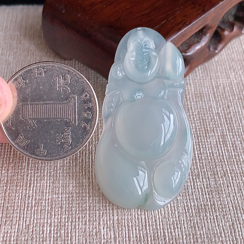 天然A货翡翠飘花布袋佛吊坠 
尺寸46-24.3-5mm 重量9.84g 0317