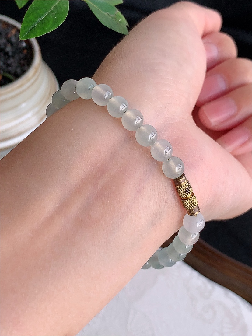 天然A货翡翠18K金伴钻镶嵌飘花蛋面圆珠佛珠手链 
尺寸10.7-7.6-7/6mm 重量13.26g 0425