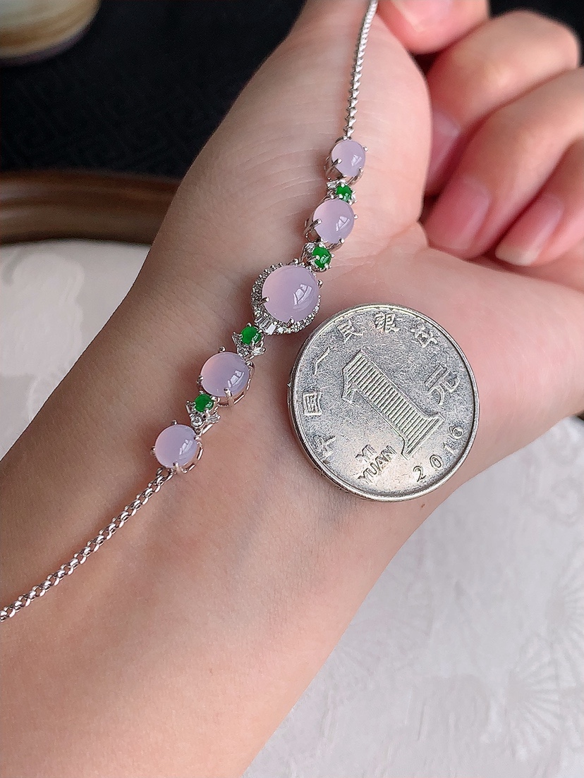 天然A货翡翠18K金伴钻镶嵌紫罗兰蛋面手链 
尺寸7-6.3-7.3mm 重量4.75g 0429