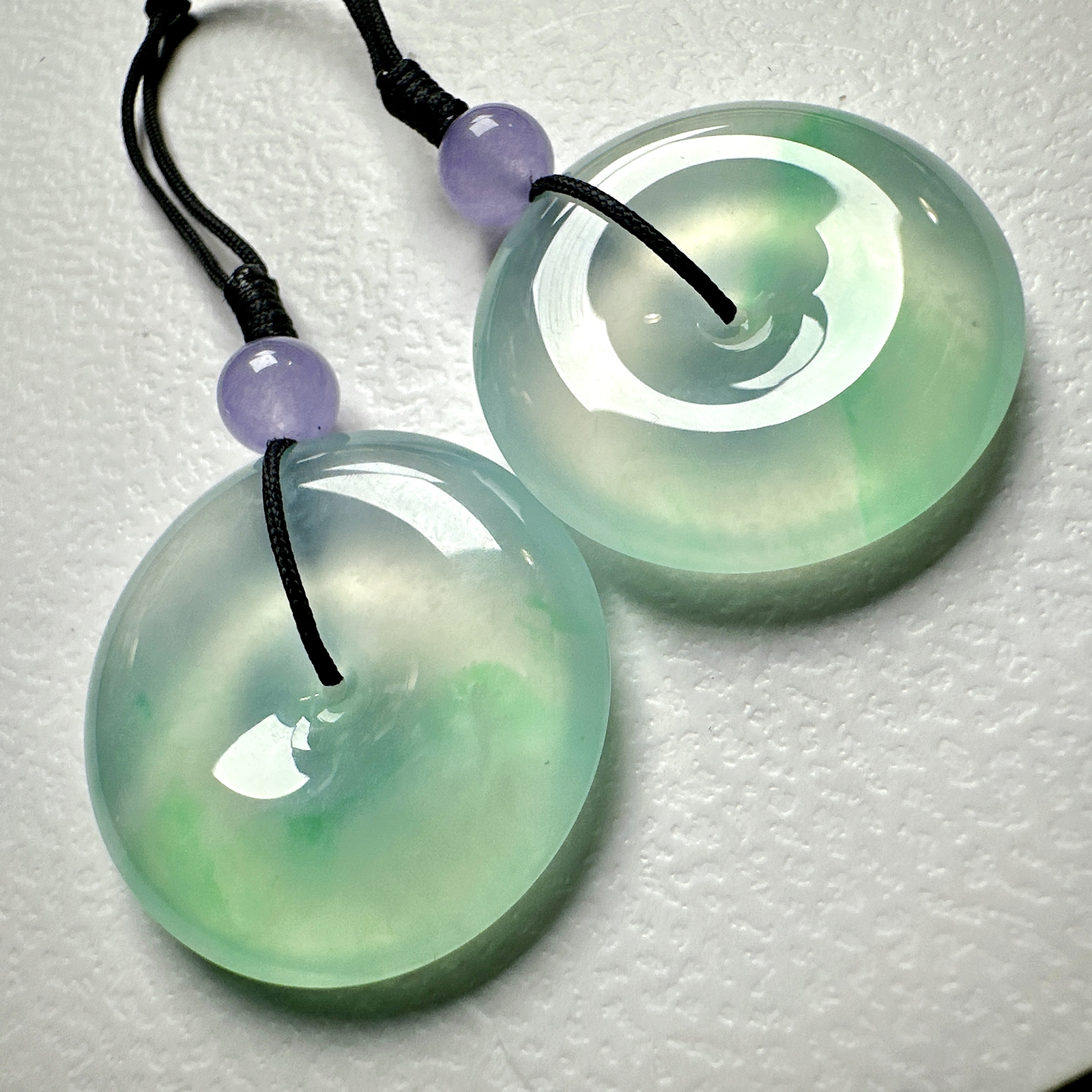 【冰种飘绿平安扣一对】质地非常细腻干净，冰润十足，种老冰透，收藏品质