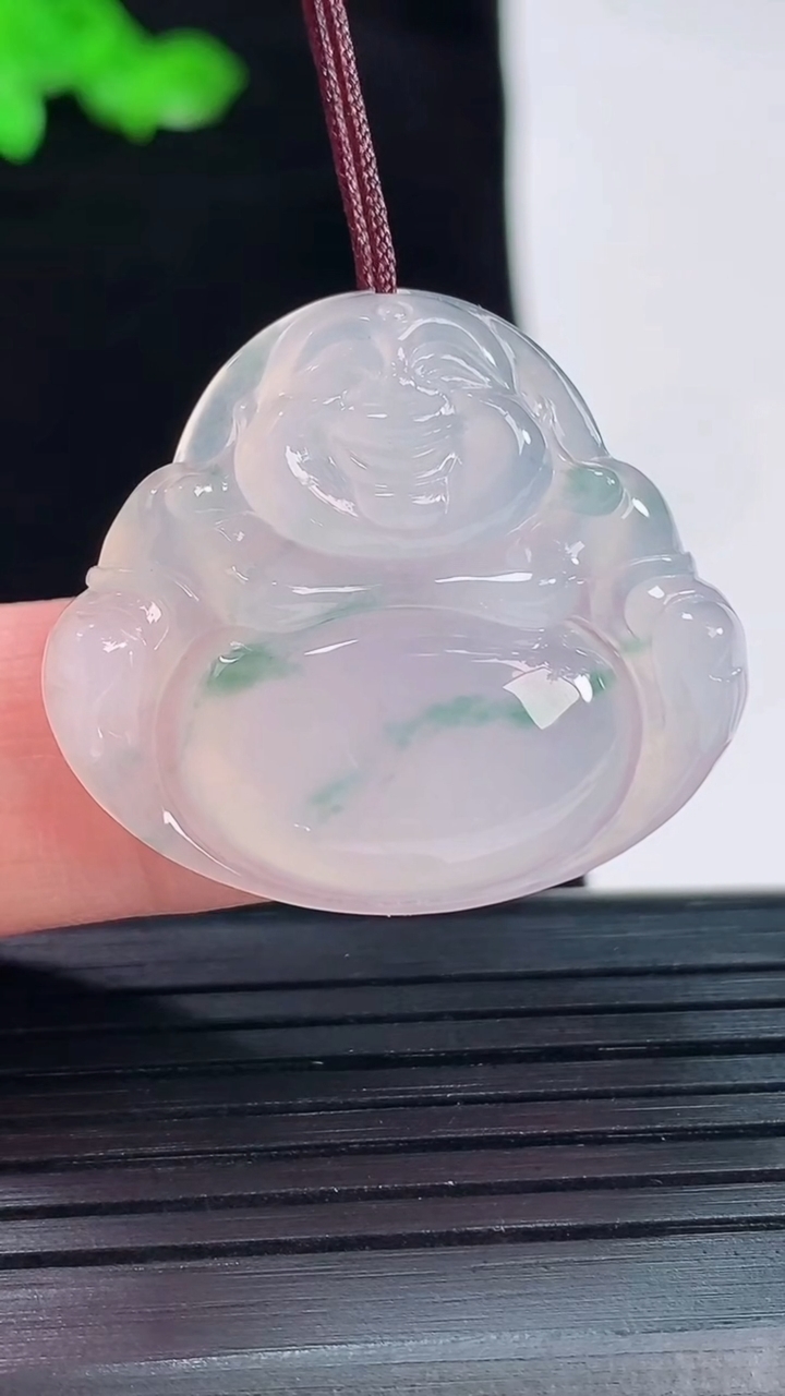 天然A货翡翠冰种飘花佛公吊坠，尺寸27.5-31-5.6重量:7.48g
5月20日