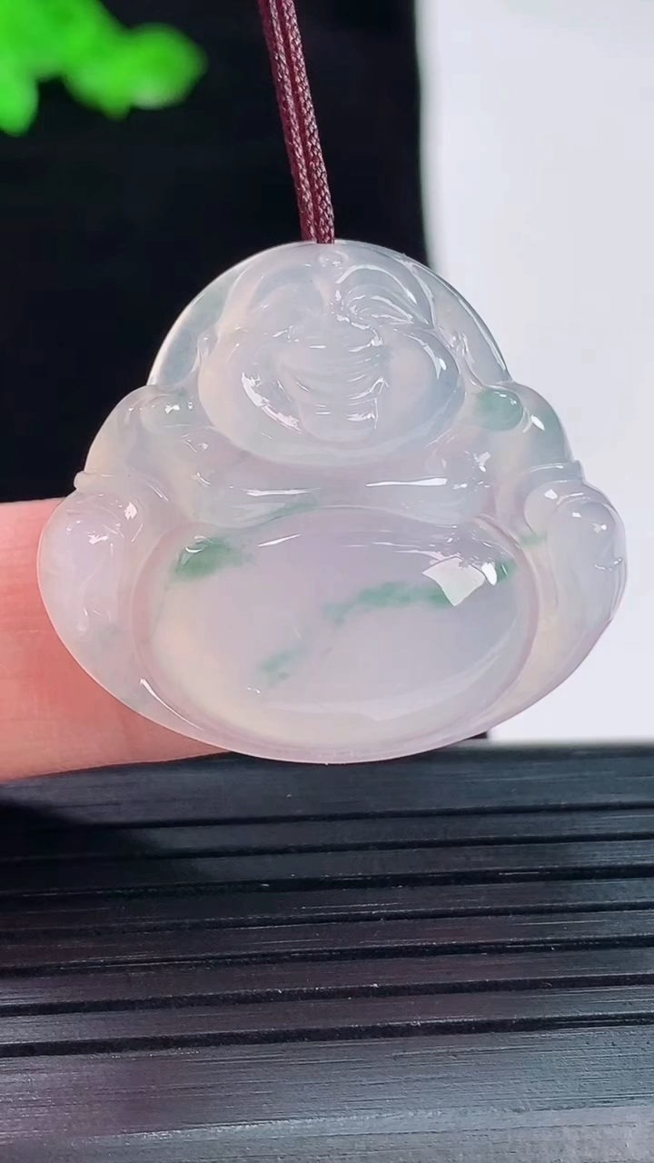天然A货翡翠冰种飘花佛公吊坠，尺寸27.5-31-5.6重量:7.48g
5月20日